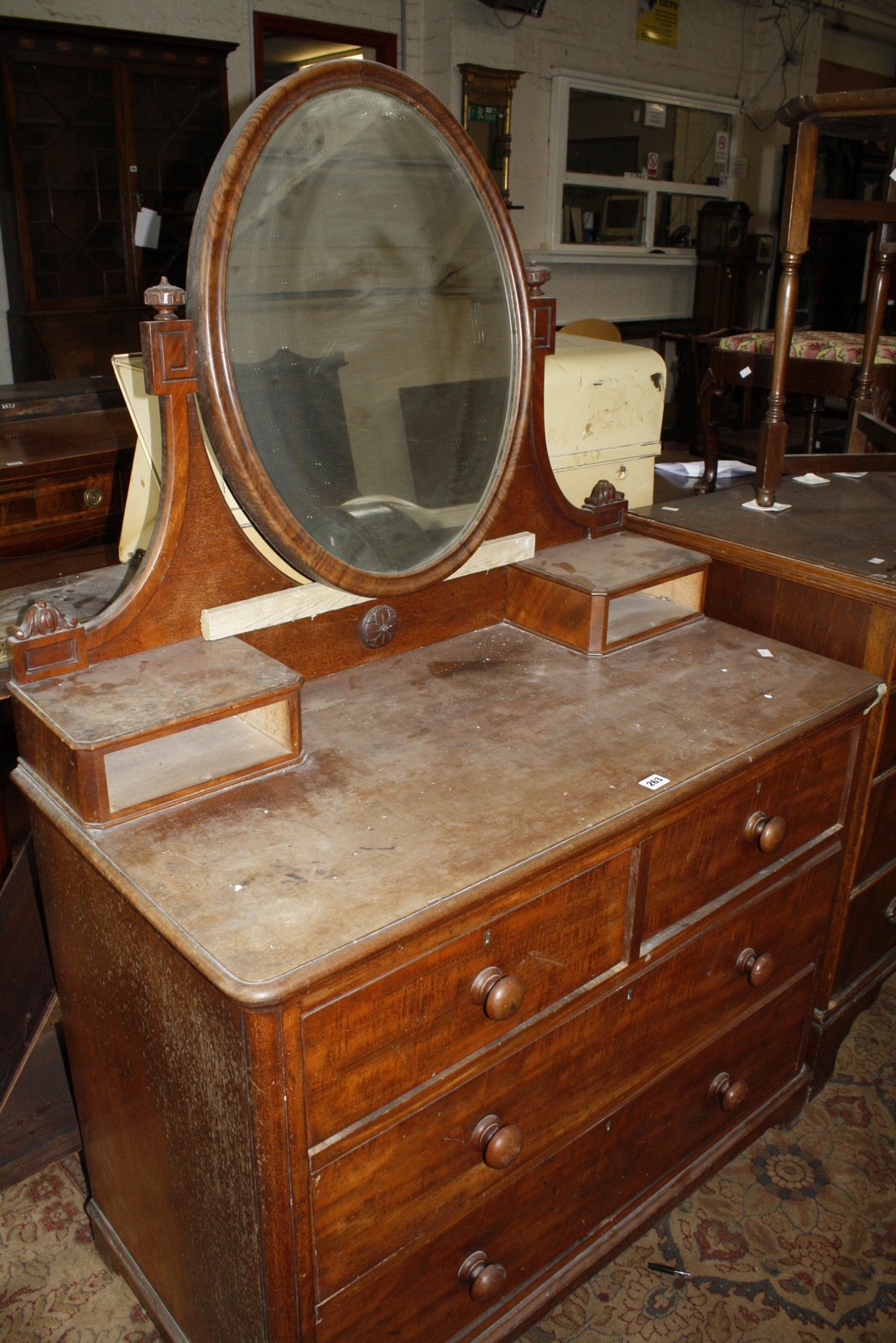 A Victorian mahogany dressing chest with central mirror. 105cm wide.