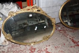 A late Victorian oval gilt mirror, together with a further gilt example and a mahogany mirror -3