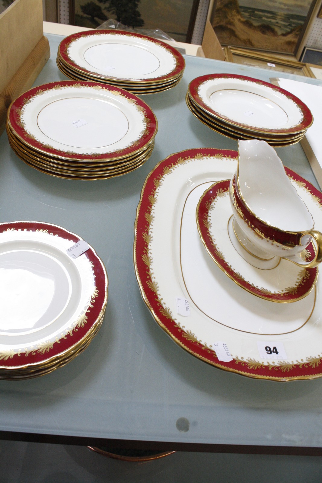 An Aynsley 'Rutland' burgundy part dinner service, pattern no: 8013, circa 1920, including one