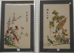 A pair 20th Century Chinese embroidered silkwork pictures, depicting exotic birds, 58.5cm x 34cm