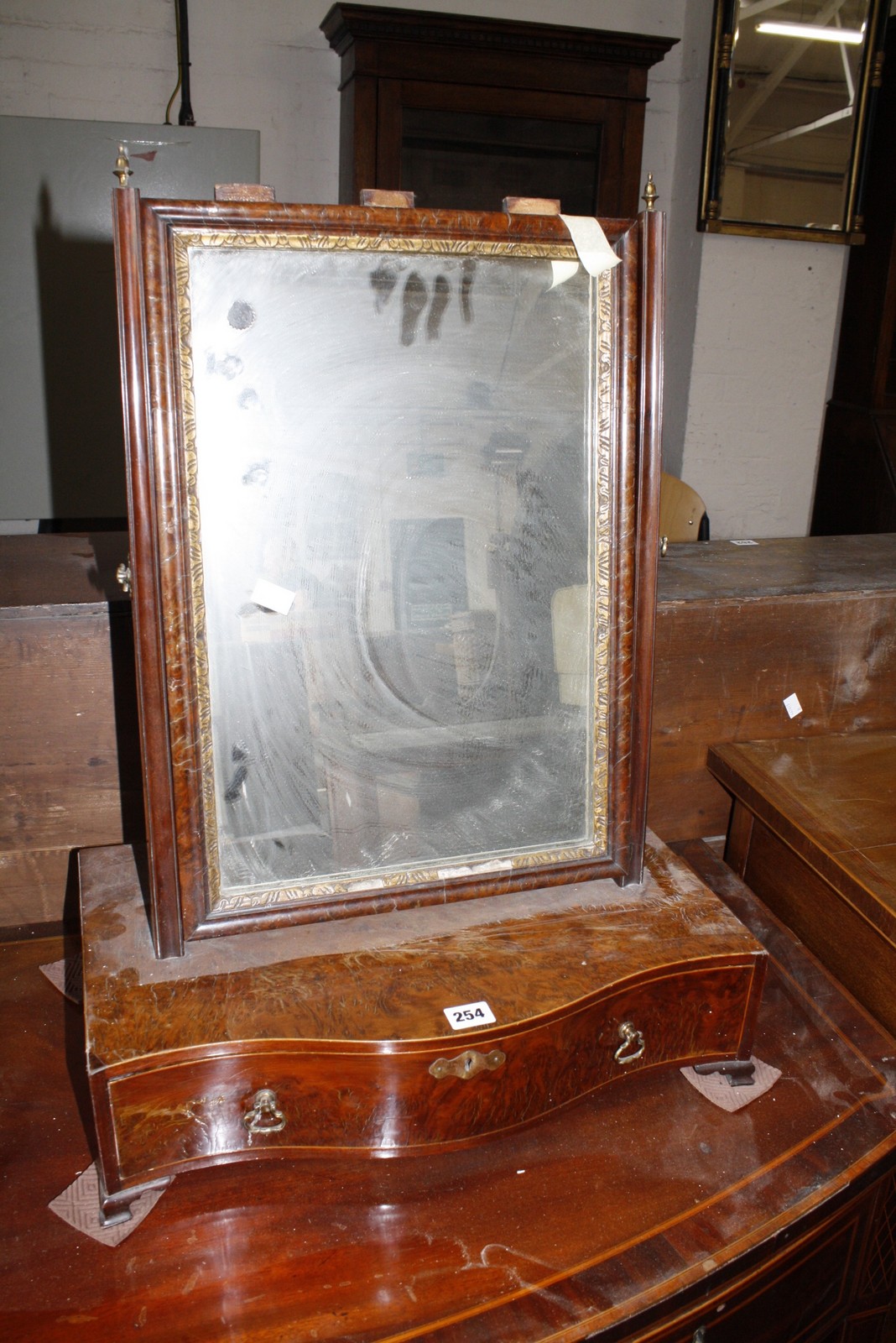 A 19th century burr walnut dressing mirror.