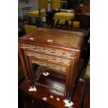 A nest of three Chinese hardwood tables, the largest 44cm wide