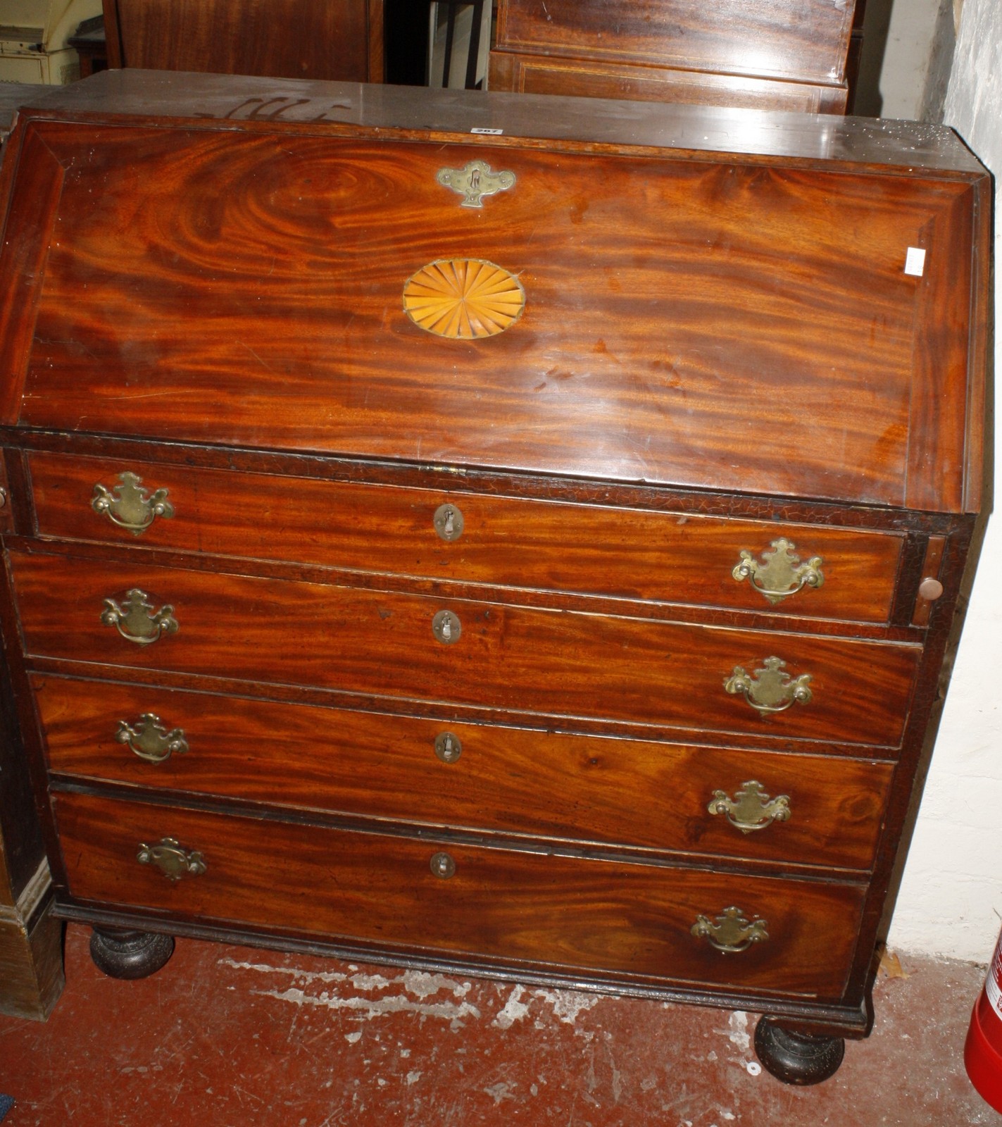 A Georgian mahogany bureau with shell inlay to the fall front 111cm high, 100cm wide Best Bid