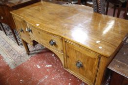 A George III mahogany sideboard, circa 1800, with shallow central bowfront 143cm wide