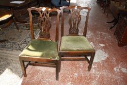 A pair of George III mahogany dining chairs.