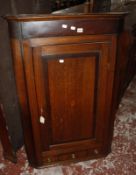 A 19th Century oak and crossbanded hanging corner cupboard.78cm wide x 115cm high. Best Bid