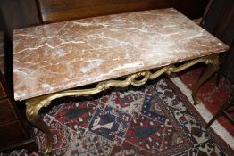 A giltwood and marble topped rectangular table in rococo style, 123cm long