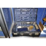 A suitcase with silver mounted fittings, London 1929, some lacking; three silver mounted small