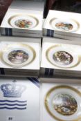 Twelve Royal Copenhagen plates depicting scenes from Hans Christian Andersen tales (boxed).