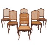 A set of six French walnut and canework dining chairs, late 19th century/early 20th century, each