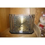 A 20th Century glazed mantel clock with brass face, the movement marked Franz Hermle, 30cm wide Best