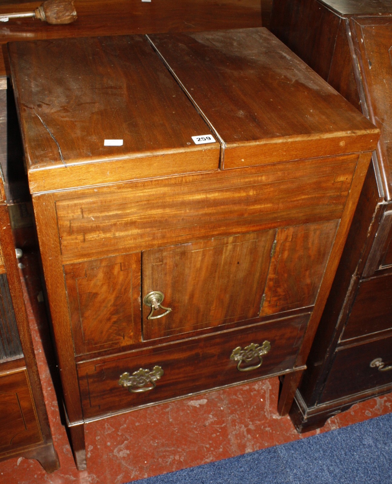 A Georgian mahogany washstand with twin foldover opening 56cm wide