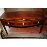 A 19th Century mahogany and crossbanded bowfront sideboard with three frieze drawers.135cm wide.