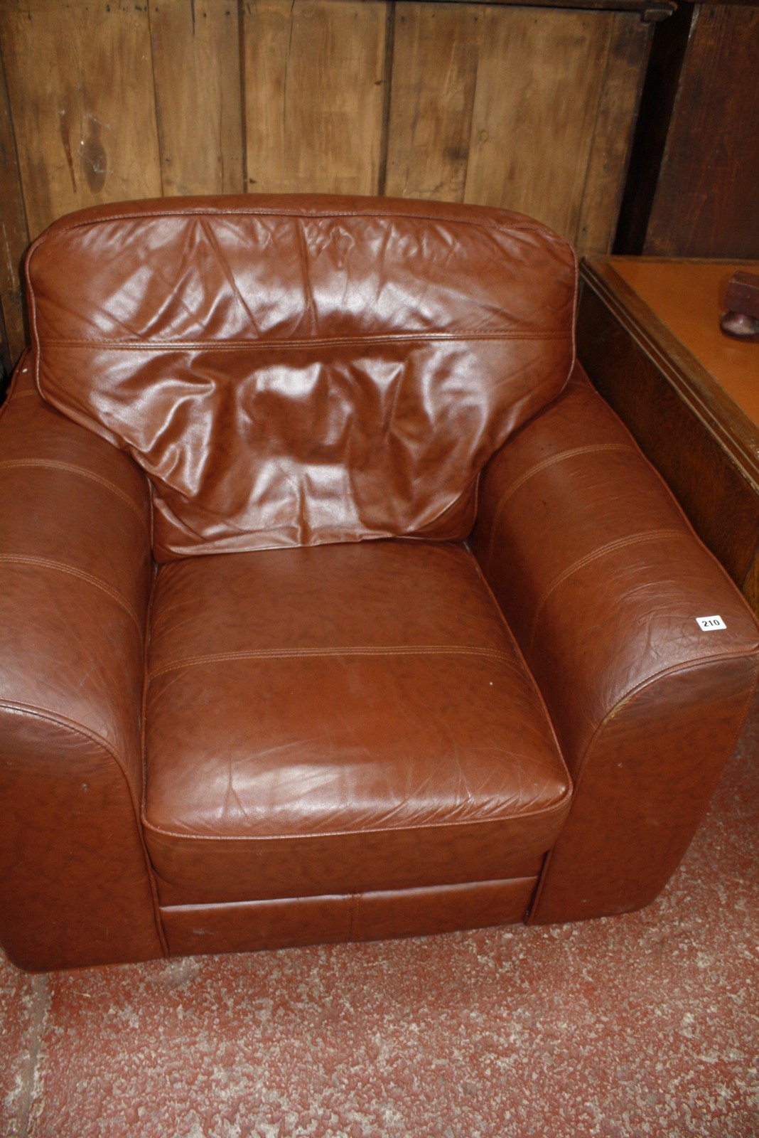 A club type leather upholstered armchair