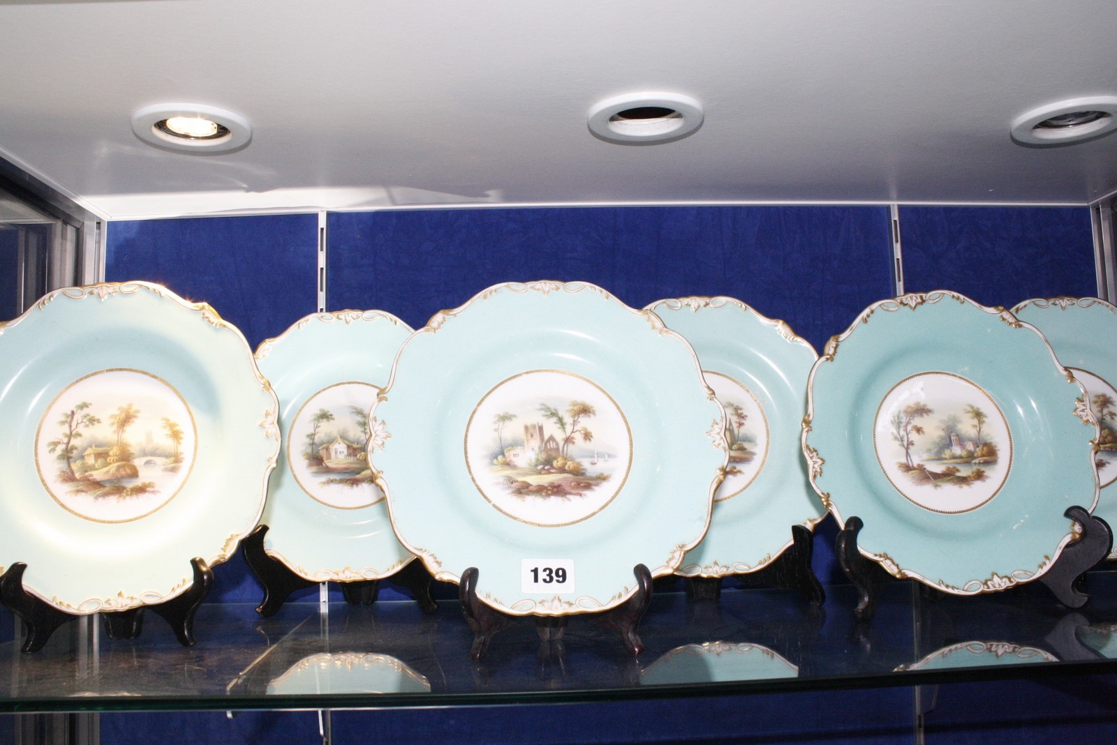 Six mid 19th century Staffordshire turquoise-ground dessert plates decorated with rustic scenes,