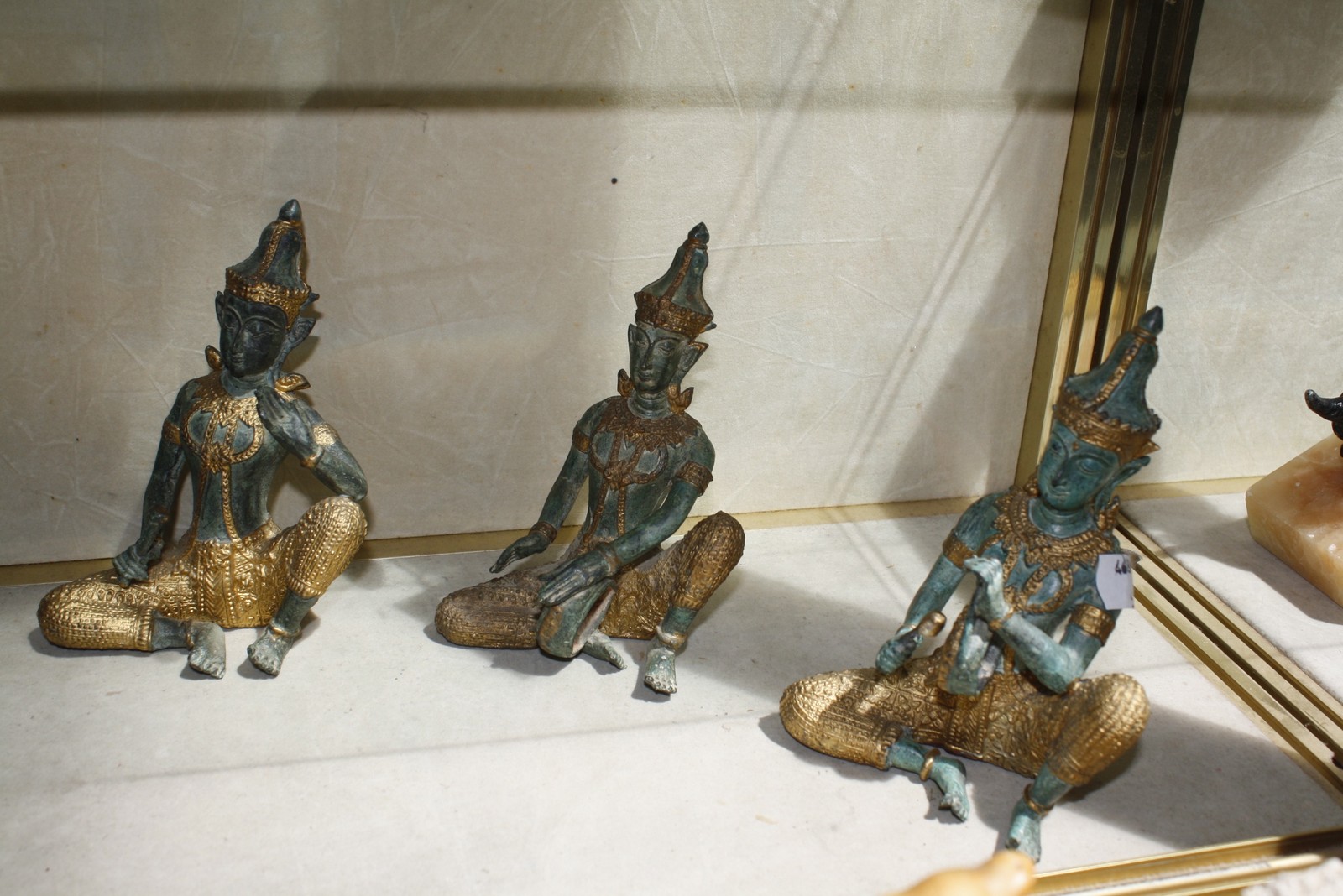 A group of six verdi gris gold finished bronze Thai musicians, 14cm high and a Thai dancer. - Image 2 of 2