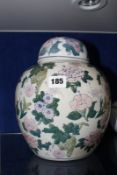 A 20th Century Chinese ginger jar, with cover, floral decorated, 25cm high Best Bid