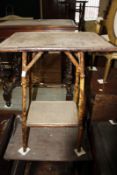 An early 19th century mahogany commode (A/F) and a Victorian bamboo table.