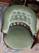 A Victorian ebonised wood and upholstered low tub chair