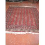 A Bokhara carpet approx 310 x 110cm