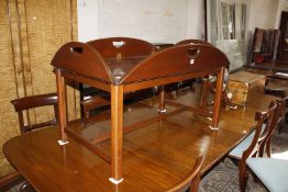 A mahogany finished butlers tray top coffee table, with detached stand.108cm x 65cm.