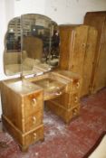 An Art Deco walnut bedroom suite, two include two wardrobes, double bed frame and a dressing table