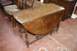 An 18th century style oak gateleg table, a 19th century mahogany D-end dining table with drop leaf