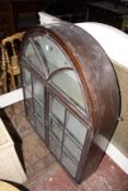 An arched display cabinet with astragal glazed doors 105cm high, 85cm wide