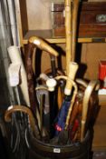 A quantity of assorted walking sticks, to include a silver mounted walking stick, an ebony and ivory