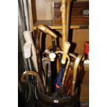 A quantity of assorted walking sticks, to include a silver mounted walking stick, an ebony and ivory