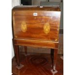 A 19th Century inlaid mahogany cellarette, with domed top on square tapering legs 44cm wide