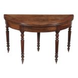 A Continental walnut folding dining table, late 18th/early 19th century, the tilt top opening to