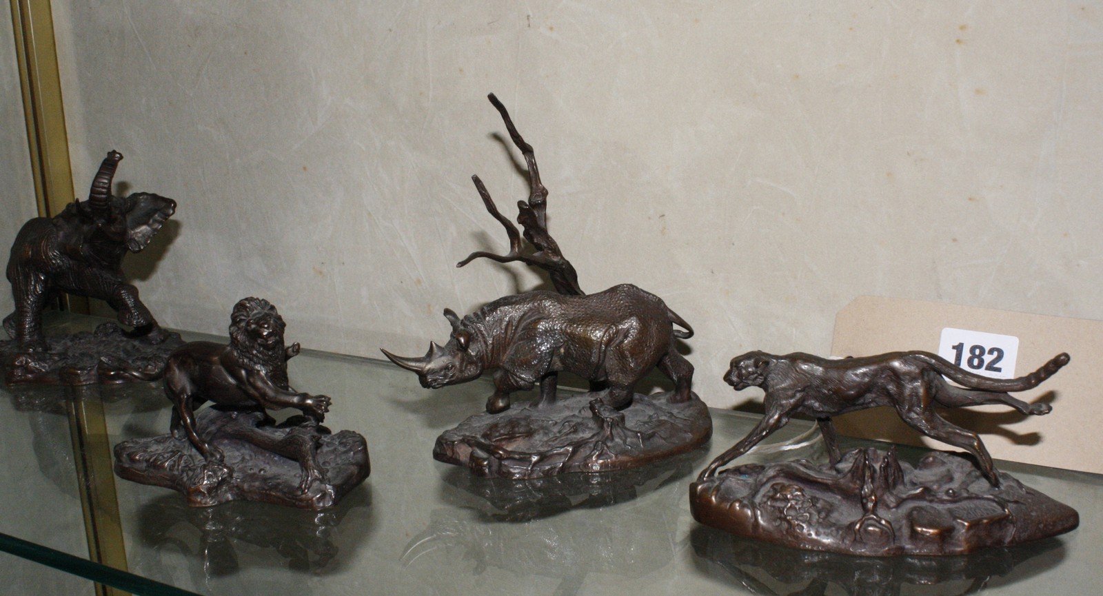 A set of six Franklin Mint bronze animals to include an elephant, giraffe, lion and rhino -6