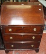 A George III style mahogany desk, with a sloping fall, three long drawers on bracket feet 71cm