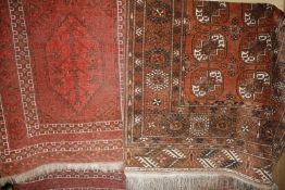 A Bokhara rug and a worn Caucasian rug