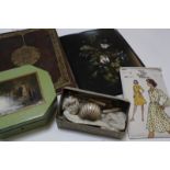 A Victorian papier mache album cover contain blank paper and some loose envelopes, writing set