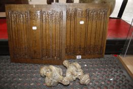 An oak ogee carved arch, two light wood finials and two oak panels with relief carving