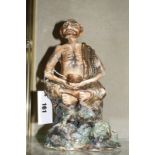 A Satsuma decorated figure of a beggar. 27cm high.