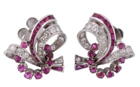 A pair of 1950's ruby and diamond earrings, of scrolling design  A pair of 1950's ruby and diamond