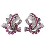 A pair of 1950's ruby and diamond earrings, of scrolling design  A pair of 1950's ruby and diamond