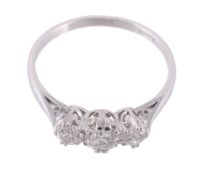 A three stone diamond ring, set with three brilliant cut diamonds in claw...  A three stone