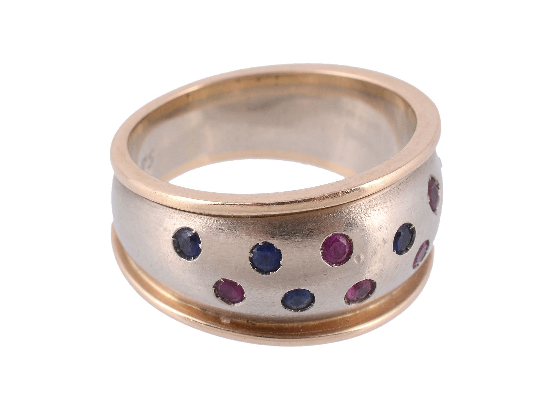 A sapphire and ruby ring, the band set with circular shaped sapphires and...  A sapphire and ruby