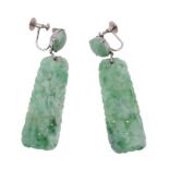 A pair of jadeite ear pendents, the carved panels with a circular shaped...  A pair of jadeite ear