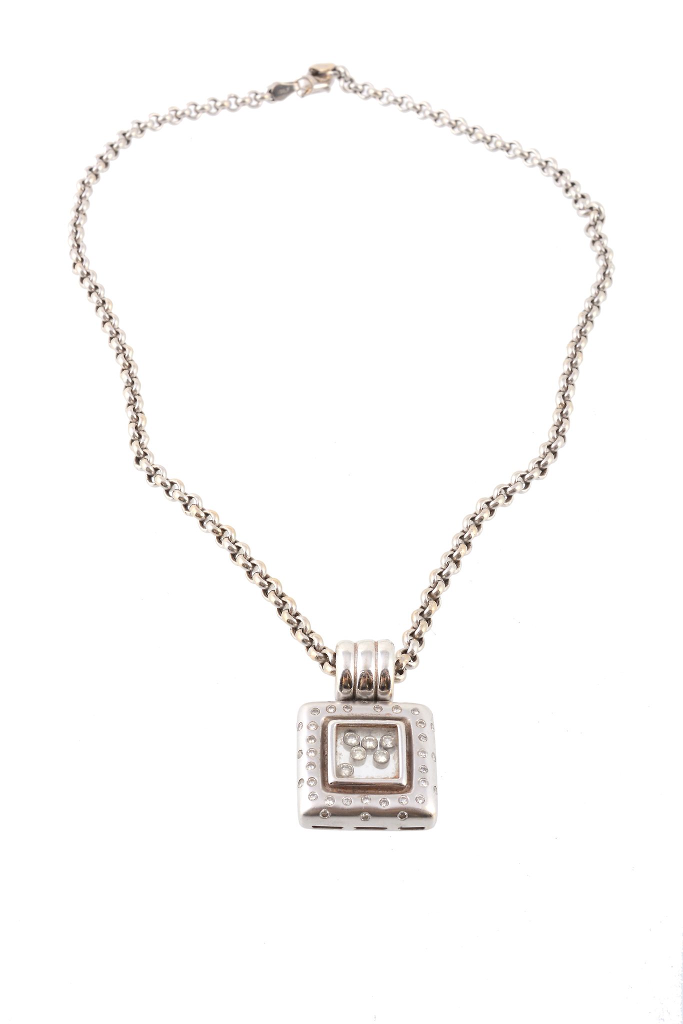 A diamond pendant, the square pendant with a central glazed compartment with...  A diamond pendant,