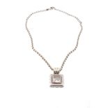 A diamond pendant, the square pendant with a central glazed compartment with...  A diamond pendant,