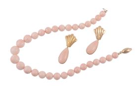 A coral bead necklace, the graduated polished coral beads on a string to a...  A coral bead