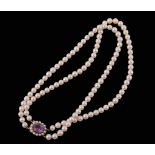 A two row cultured pearl necklace, composed of uniform 6mm cultured pearls  A two row cultured pearl