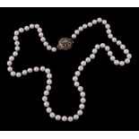 A cultured pearl necklace, the uniform cultured pearls to a rose cut diamond...  A cultured pearl