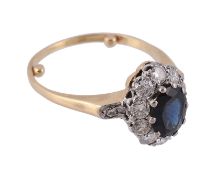 A sapphire and diamond ring, the central oval shaped sapphire claw set...  A sapphire and diamond