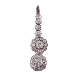 A diamond double cluster drop pendant, the clusters each set with a central...  A diamond double